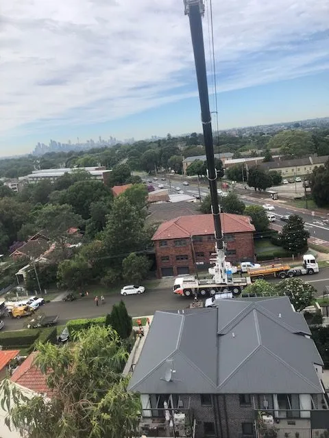 Crane working between apartment buildings